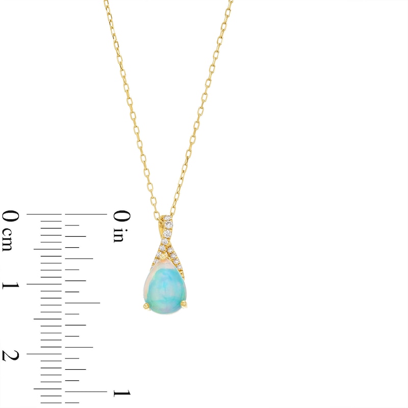 Pear-Shaped Opal and 1/20 CT. T.W. Diamond Ribbon Pendant in 10K Gold