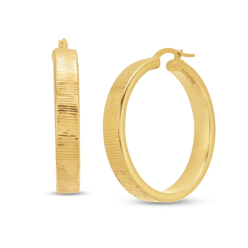 Diamond-Cut 30.0 x 6.0mm Oval Hoop Earrings in Hollow 14K Gold