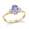 Thumbnail Image 1 of Oval Tanzanite and 1/6 CT. T.W. Diamond Three Stone Ring in 14K Gold