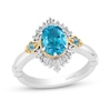 Thumbnail Image 0 of Enchanted Disney Jasmine Oval Swiss Blue Topaz and 1/5 CT. T.W. Baguette Diamond Frame Ring in 14K Two-Tone Gold