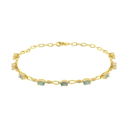 Oval-Shaped Opal and 1/8 CT. T.W. Diamond Bracelet in 10K Gold - 7.25&quot;