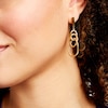 Thumbnail Image 1 of Diamond-Cut Interlocking Circles Dangle Drop Earrings in Hollow 10K Gold