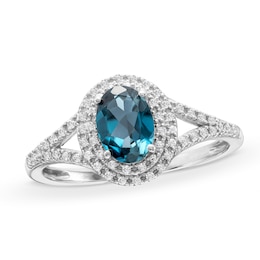 Oval London Blue Topaz and 1/6 CT. T.W. Diamond Framed Ring in 10K White Gold