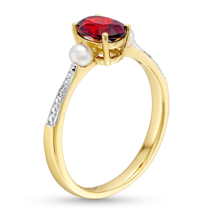 Oval Garnet, Cultured Freshwater Pearl and Diamond Accent Three Stone Ring in 10K Gold