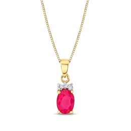 Oval Ruby and 1/20 CT. T.W. Diamond Tri-Top Pendant in 14K Gold