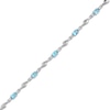 Thumbnail Image 1 of Oval Swiss Blue Topaz and White Lab-Created Sapphire Bypass Link Alternating Bracelet in Sterling Silver - 7.25”