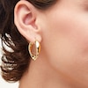 Thumbnail Image 2 of Swirl Hoop Earrings in Hollow 14K Gold