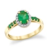 Thumbnail Image 1 of Oval Emerald and 1/6 CT. T.W. Diamond Frame Ring in 14K Gold