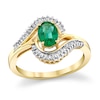 Thumbnail Image 0 of Oval Emerald and 1/3 CT. T.W. Baguette Diamond Shadow Bypass Ring in 14K Gold