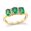 Thumbnail Image 1 of Oval Emerald and 1/20 CT. T.W. Diamond Three Stone Ring in 10K Gold