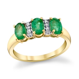 Oval Emerald and 1/20 CT. T.W. Diamond Three Stone Ring in 10K Gold