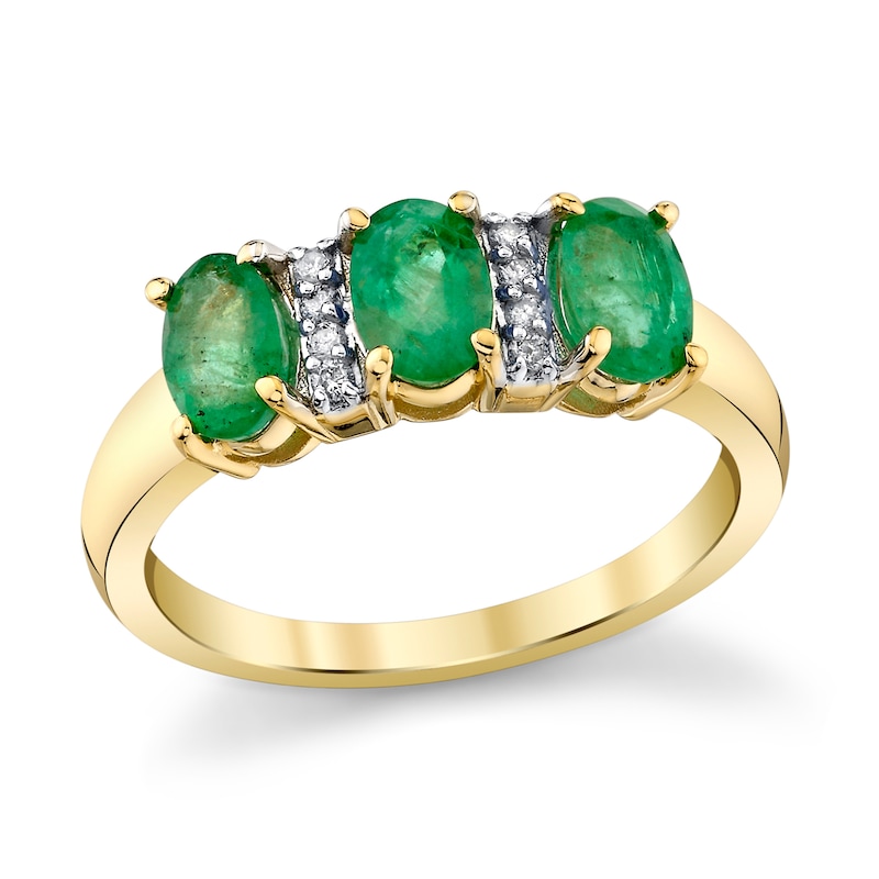 Main Image 1 of Oval Emerald and 1/20 CT. T.W. Diamond Three Stone Ring in 10K Gold