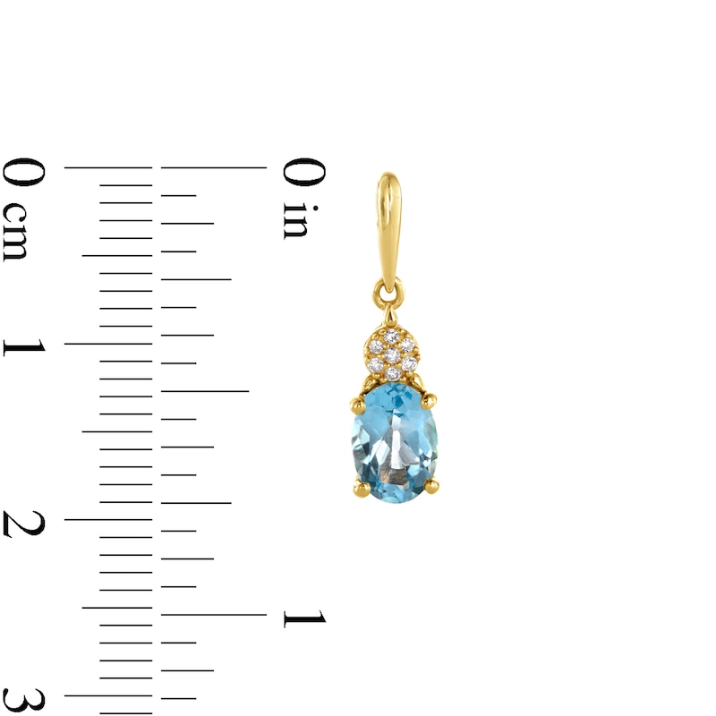 Oval Swiss Blue Topaz and 1/20 CT. T.W. Diamond Drop Earrings in 10K Gold