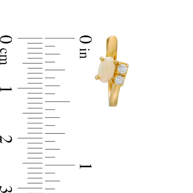 Main Image 3 of Oval Opal and 1/10 CT. T.W. Diamond Bypass Huggie Hoop Earrings in 10K Gold