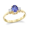 Thumbnail Image 1 of Oval Tanzanite and 1/8 CT. T.W. Diamond Three Stone Ring in 14K Gold