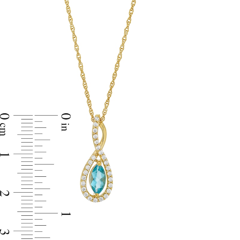 Marquise Swiss Blue Topaz and 1/5 CT. T.W. Diamond Infinity Twist Pendant in 10K Gold