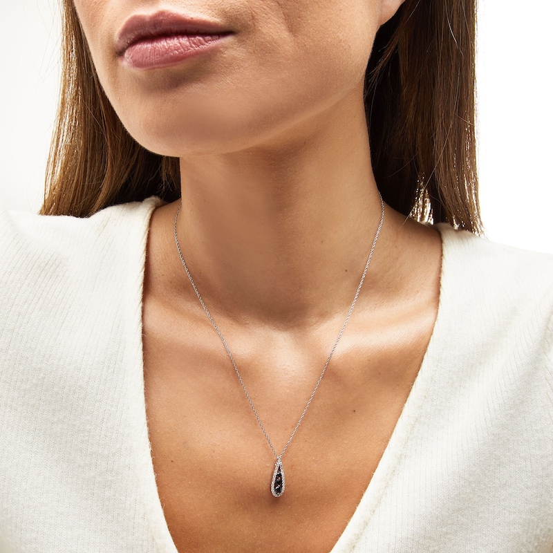 1/2 CT. T.W. Black and White Diamond Graduated Three Stone Teardrop Pendant in Sterling Silver