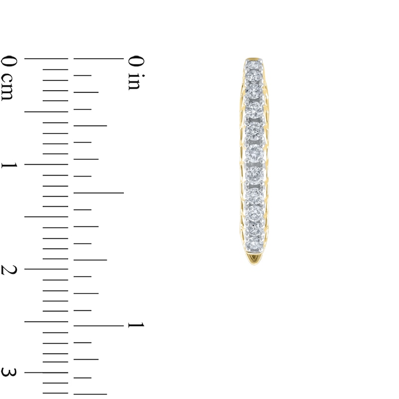 Main Image 3 of 1/2 CT. T.W. Diamond Graduated Oval Hoop Earrings in 10K Gold