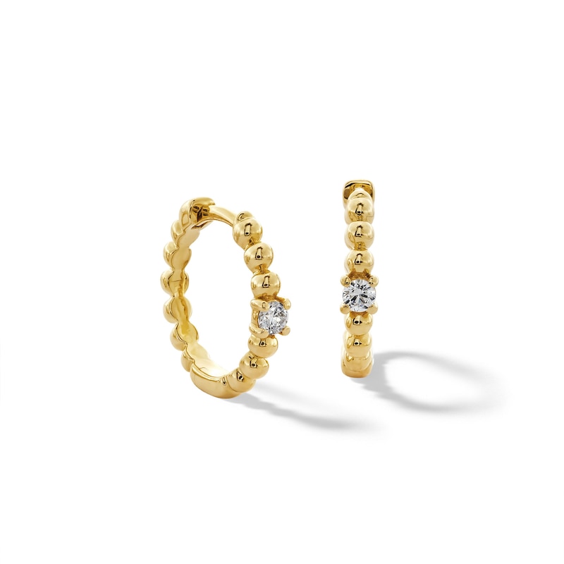 Main Image 1 of 1/8 CT. T.W. Diamond Solitaire Beaded Hoop Earrings in 10K Gold