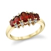 Thumbnail Image 1 of Oval Garnet and 1/20 CT. T.W. Diamond Graduated Five Stone Ring in 10K Gold