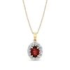 Thumbnail Image 1 of Oval Garnet and 1/8 CT. T.W. Diamond Swirl Frame Pendant in 10K Gold