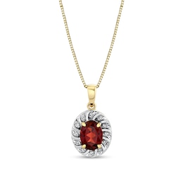 Oval Garnet and 1/8 CT. T.W. Diamond Swirl Frame Pendant in 10K Gold