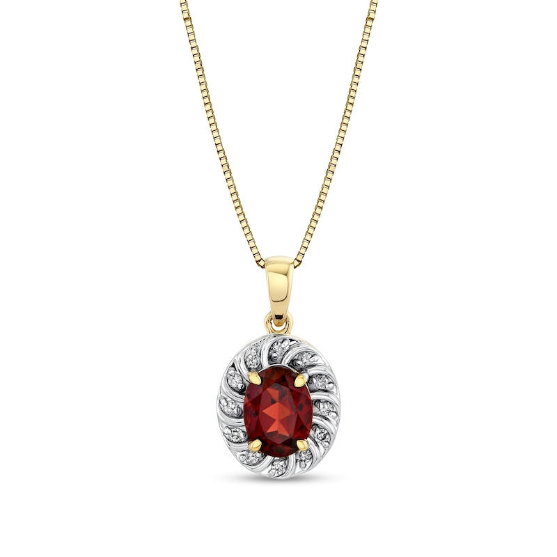 Main Image 1 of Oval Garnet and 1/8 CT. T.W. Diamond Swirl Frame Pendant in 10K Gold