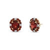 Thumbnail Image 1 of Oval and Round Garnet with 1/4 CT. T.W. Diamond Scallop Frame Stud Earrings in 10K Gold