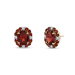 Oval and Round Garnet with 1/4 CT. T.W. Diamond Scallop Frame Stud Earrings in 10K Gold