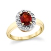 Thumbnail Image 1 of Oval Garnet and 1/8 CT. T.W. Diamond Swirl Frame Ring in 10K Gold