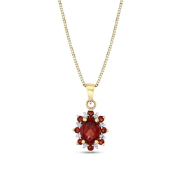 Oval Garnet and 1/20 CT. T.W. Diamond Alternating Frame Pendant in 14K Gold