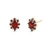 Thumbnail Image 1 of Oval Garnet and 1/15 CT. T.W. Diamond Alternating Frame Stud Earrings in 14K Gold