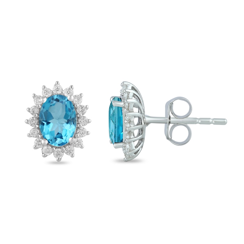 Main Image 2 of Oval Swiss Blue Topaz and 1/3 CT. T.W. Certified Lab-Created Diamond Sunburst Frame Stud Earrings in 14K White Gold