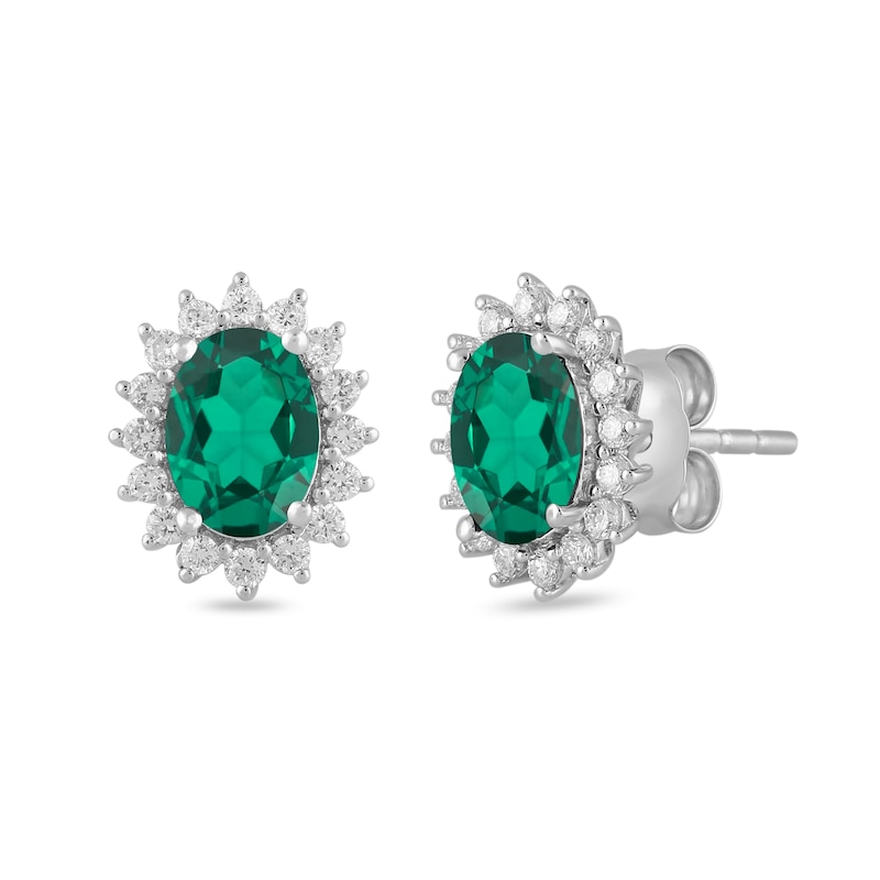 Main Image 1 of Oval Lab-Created Emerald and 1/3 CT. T.W. Certified Lab-Created Diamond Sunburst Frame Stud Earrings in 14K White Gold