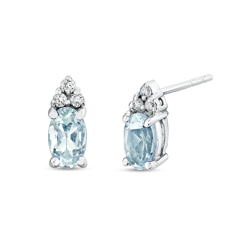 Main Image 1 of Oval Aquamarine and 1/20 CT. T.W. Diamond Tri-Top Stud Earrings in 14K White Gold