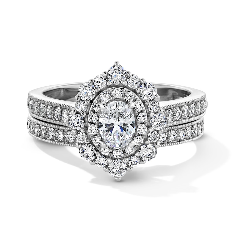 Main Image 1 of 1-1/5 CT. T.W. Oval Diamond Double Quatrefoil Frame Vintage-Style Bridal Set in 14K White Gold