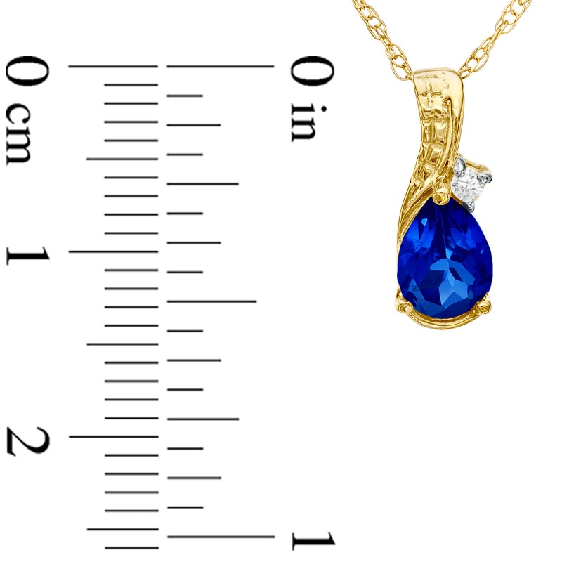 Previously Owned - Pear-Shaped Lab-Created Blue Sapphire and Diamond Accent Teardrop Pendant in 10K Gold
