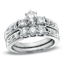 Previously Owned 1-1/2 CT. T.W. Diamond Three Stone Soldered Bridal Set in 14K White Gold