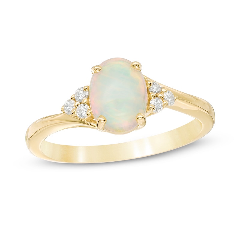 Previously Owned - Oval Opal and 1/10 CT. T.W. Diamond Tri-Sides Ring in 10K Gold