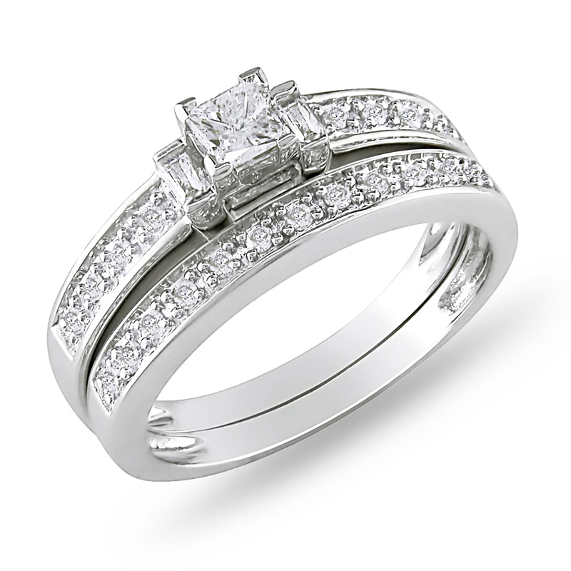 Previously Owned - 1/3 CT. T.W. Princess-Cut and Baguette Diamond Three Stone Bridal Set in Sterling Silver