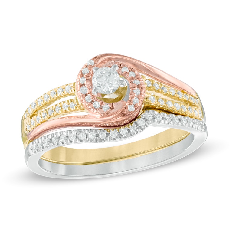 Previously Owned - 1/3 CT. T.W. Diamond Swirl Bridal Set in 10K Tri-Tone Gold