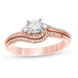 Previously Owned 1/4 CT. T.W. Diamond Bypass Three Stone Soldered Bridal Set in 10K Rose Gold