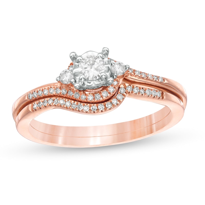 Main Image 1 of Previously Owned 1/4 CT. T.W. Diamond Bypass Three Stone Soldered Bridal Set in 10K Rose Gold