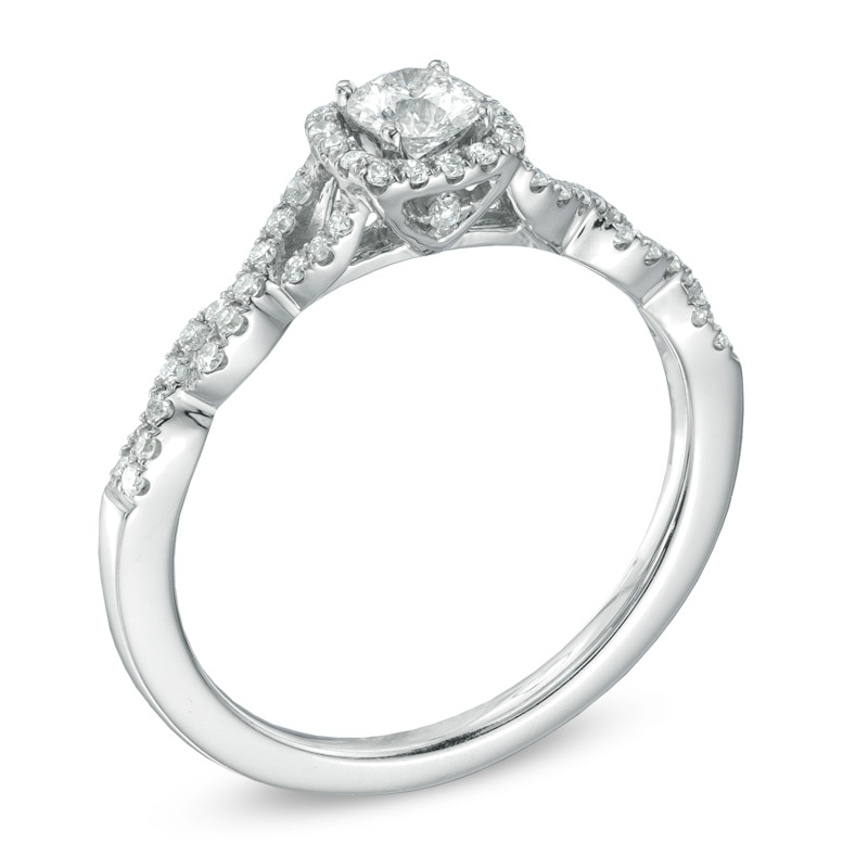 Previously Owned - Celebration Fire™ 1/2 CT. T.W. Diamond Frame Twist Engagement Ring in 14K White Gold (H-I/SI1-SI2)