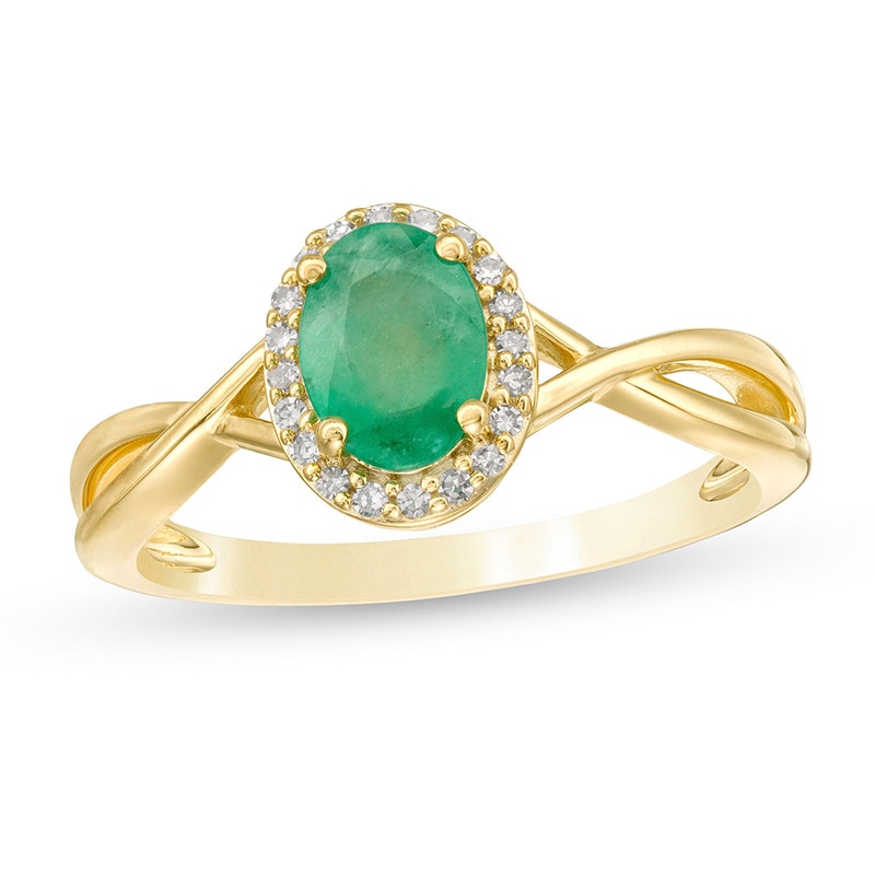 Previously Owned - Oval Emerald and 1/15 CT. T.W. Diamond Frame Twist Shank Ring in 10K Gold