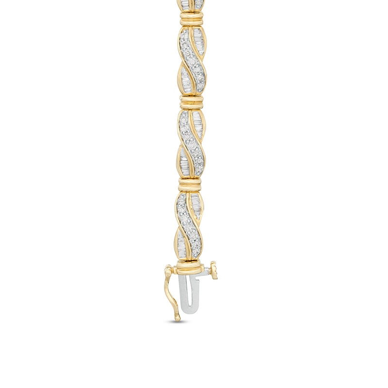 Previously Owned - 2 CT. T.W. Baguette and Round Diamond Crossover Link Bracelet in 10K Gold - 7.5"