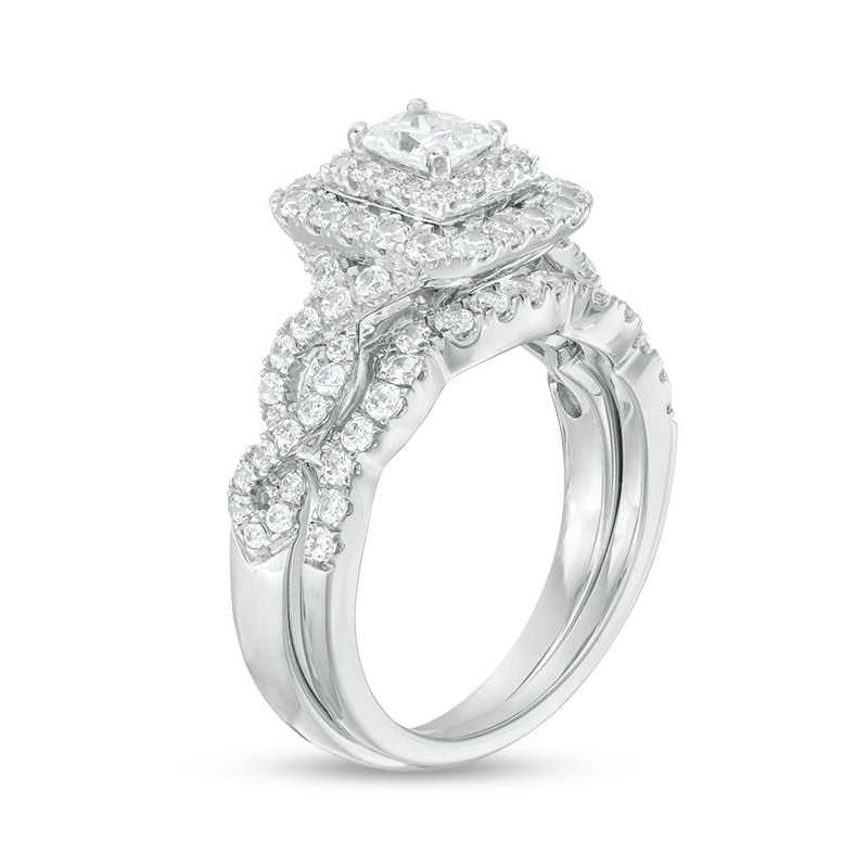 Main Image 2 of Previously Owned - 1-1/2 CT. T.W.  Radiant-Cut Diamond Frame Twist Shank Bridal Set in 14K White Gold (I/I1)