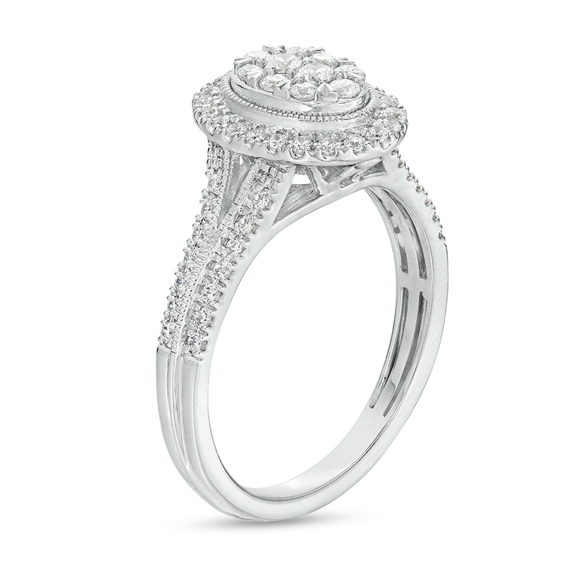 Previously Owned - 1/2 CT. T.W. Oval Multi-Diamond Frame Split Shank Engagement Ring in 10K White Gold