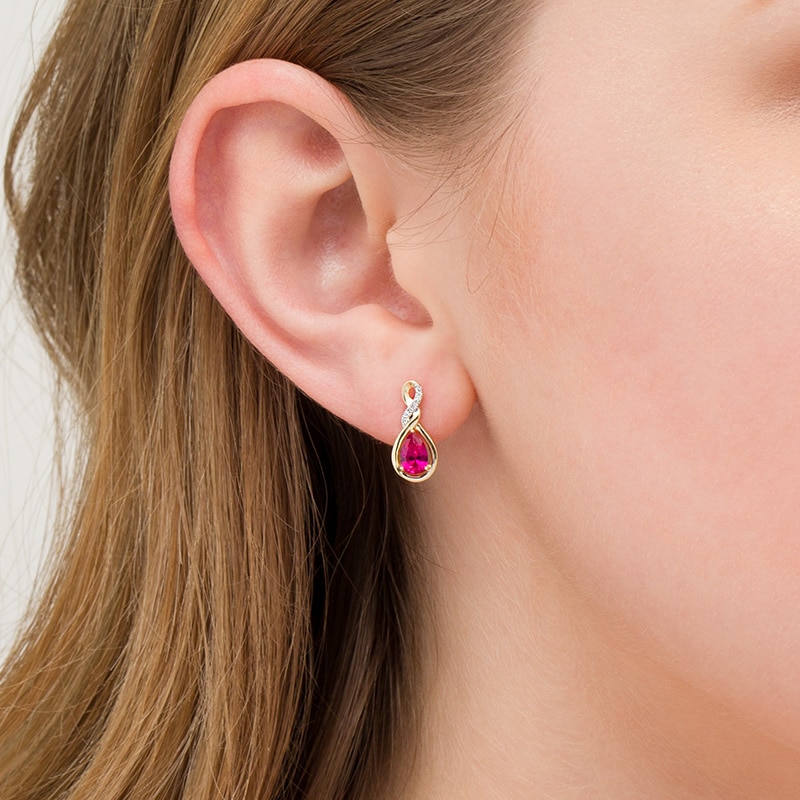 Main Image 2 of Previously Owned - Pear-Shaped Lab-Created Ruby and 1/20 CT. T.W. Diamond Cascading Teardrop Earrings in 10K Gold